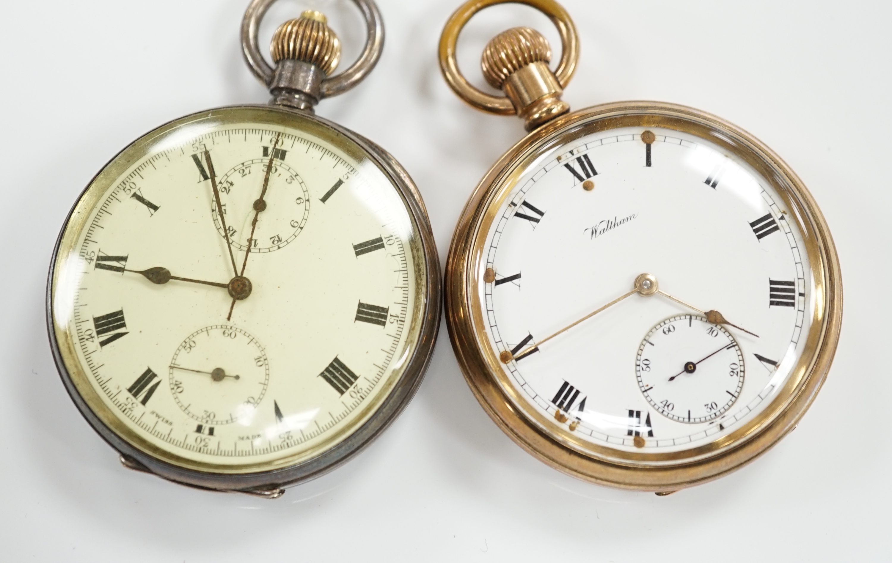 A Swiss 935 white metal open faced keyless pocket watch and a Waltham gold plated pocket watch.